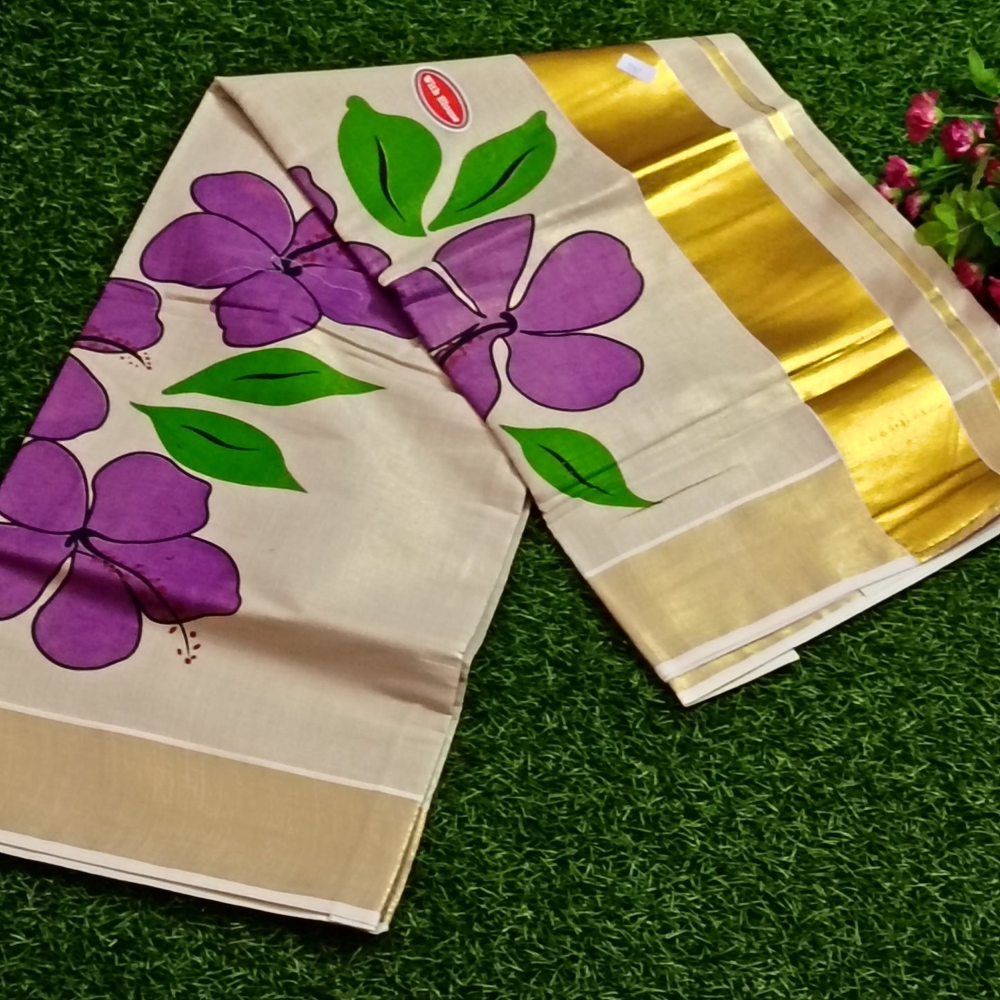 Kerala Tissue Saree with Hand-Painted Hibiscus & Gold Zari Border