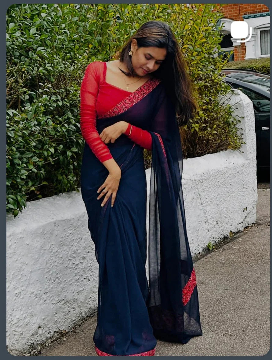 Saree with stitched Blouse.